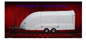 White vehicle trailer overlaid in front of a stage and curtain