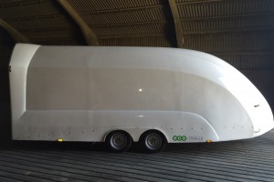 White enclosed vehicle trailer inside a building