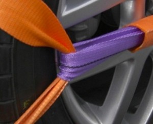 orange and purple wheel traps wrapped around an alloy wheel