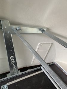 Tyre wheel rack fitted to a white enclosed trailer
