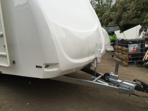 Close up of the front of a white vehicle trailer