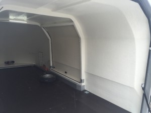Inside of a white enclosed vehicle trailer