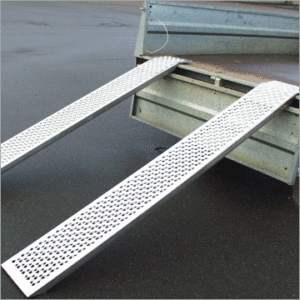 two silver straight aluminium ramps out the back of a trailer