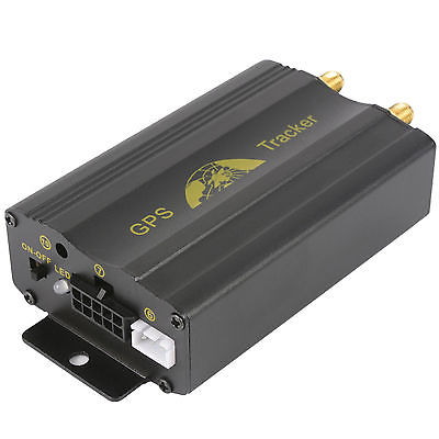 Black GPS tracker with gold coloured fittings