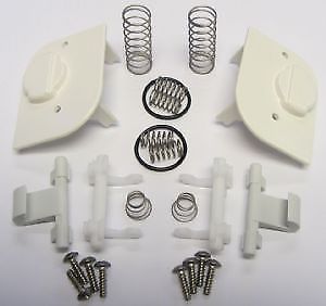 Springs screws rubber seals and plastic pieces on a white table
