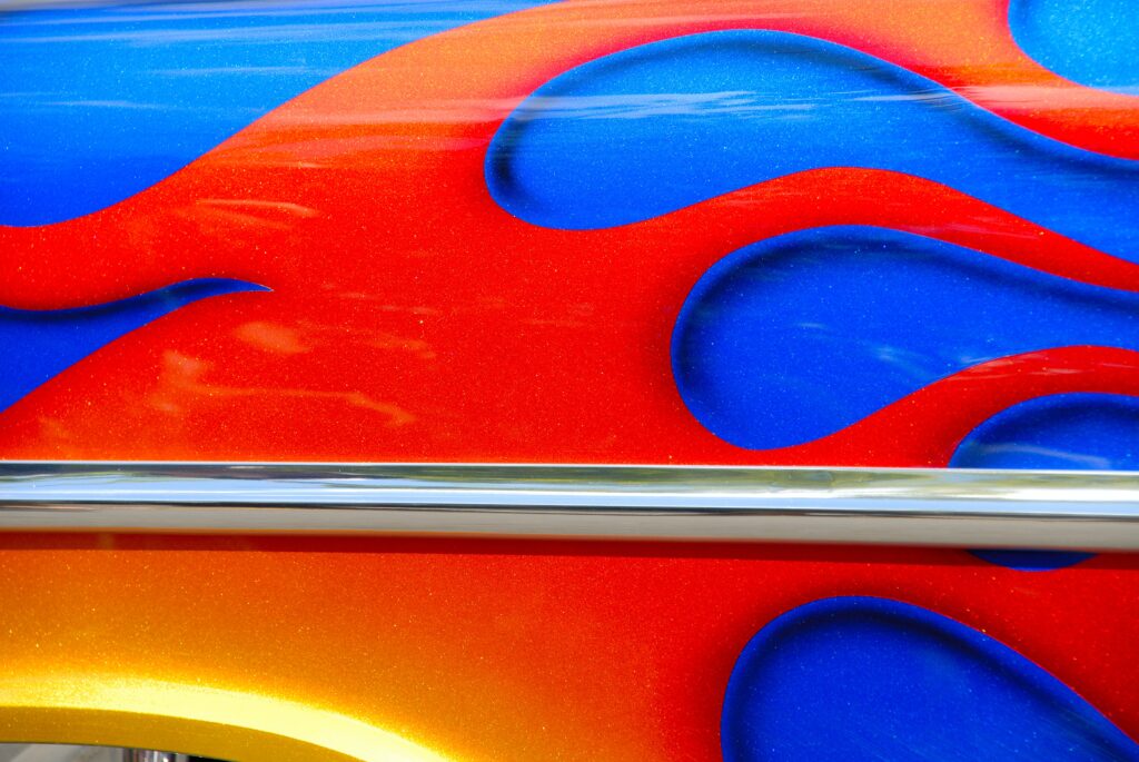 Orange flame design on a blue vehicle